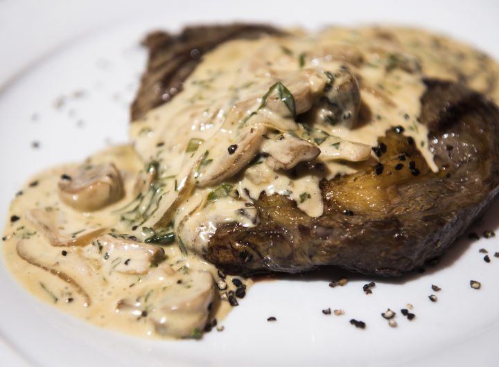 Roast steak covered with creamy mushroom sauce